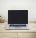 mac-book-pro-on-top-of-brown-table.jpg MacBook Pro on top of brown table